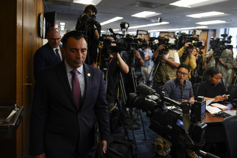 U.S. Attorney Martin Estrada, left, arrives for a news conference where he announced charges against the former longtime interpreter for Los Angeles Dodgers star Shohei Ohtani during a news conference Thursday, April 11, 2024, in Los Angeles. Ippei Mizuhara is being charged with federal bank fraud for crimes involving gambling debts and theft of millions of dollars from the Japanese sensation, federal authorities said. (AP Photo/Ryan Sun)