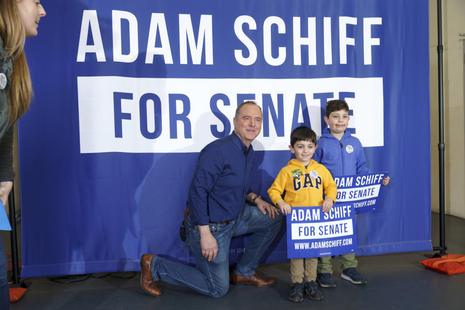 U.S. Rep. Adam Schiff, D-Calif., kneels down to take a picture with young supporters after addressing members of the International Alliance of Theatrical Stage Employees at their Union Hall in Burbank, Calif., Saturday, Feb. 11, 2023. Two weeks earlier, Schiff launched his campaign for the U.S. Senate, raising $1.6 million in chiefly small-dollar donations. Schiff was quickly endorsed by Speaker Emerita Nancy Pelosi and 40 percent of the California Democratic congressional delegation. (AP Photo/Damian Dovarganes)