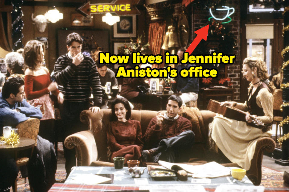 The cast of "Friends" in Central Perk with an arrow pointing out a sign in the background that Jennifer Aniston owns