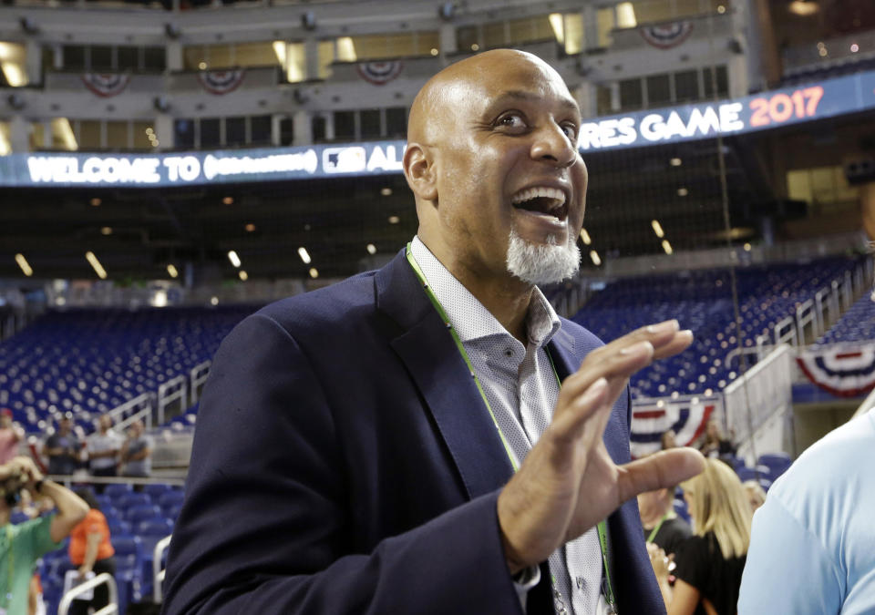 FILE - In this July 9, 2017, file photo, Tony Clark, head of the MLB Players Association, stands on the field before the All-Star Futures baseball game in Miami. Union head Tony Clark says he applauds the Toronto Blue Jays’ decision to give minor league players a 50 percent raise and hopes that other clubs will follow suit. Representatives from the players’ association made a scheduled visit to Blue Jays spring training camp Monday, March 18, 2019, a day after The Athletic reported the team planned to provide raises for all minor league players, some of whom made as little as $1,100 per month in recent seasons. (AP Photo/Lynne Sladky, File)
