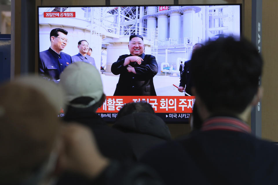 People watch a TV showing an image of North Korean leader Kim Jong Un during a news program at the Seoul Railway Station in Seoul, South Korea, Saturday, May 2, 2020. Kim made his first public appearance in 20 days as he celebrated the completion of a fertilizer factory near Pyongyang, state media said Saturday, ending an absence that had triggered global rumors that he was seriously ill. (AP Photo/Ahn Young-joon)