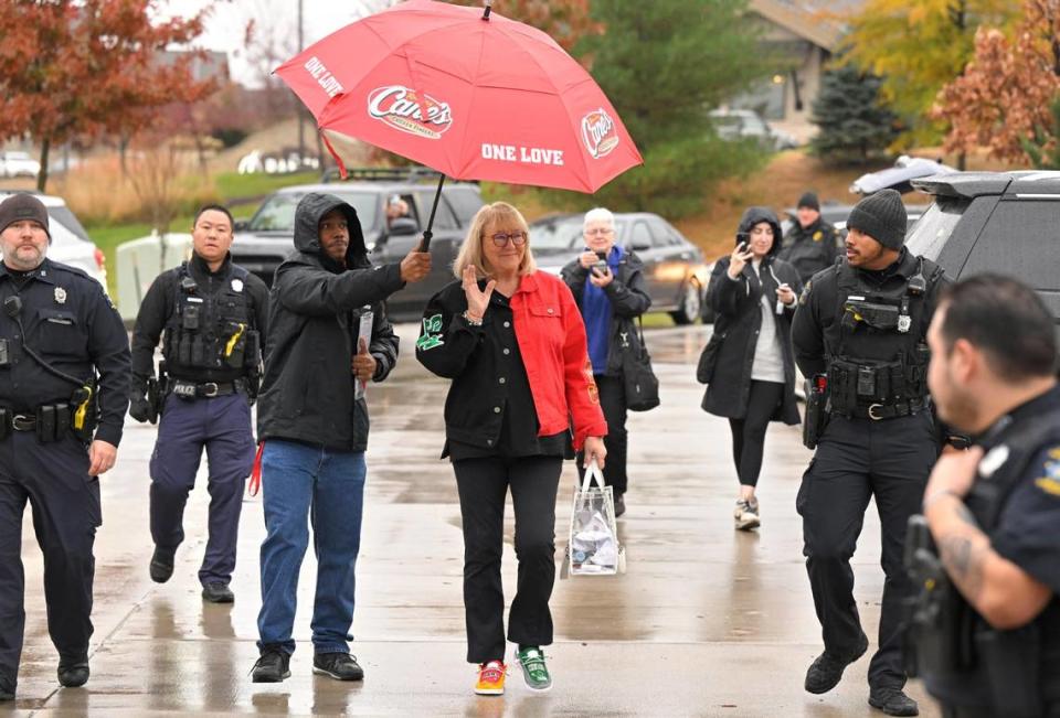 Donna Kelce, the mother of Chiefs tight end Travis Kelce and Eagles center Jason Kelce, is escorted into Raising Cane’s.