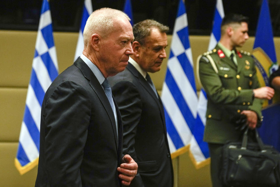 Greek Defence Minister Nikos Panagiotopoulos and his Israeli counterpart Yoav Galand, left, arrive for a meeting in Athens, Thursday, May 4, 2023. Galand is in Greece on an official visit. (AP Photo/Thanassis Stavrakis)
