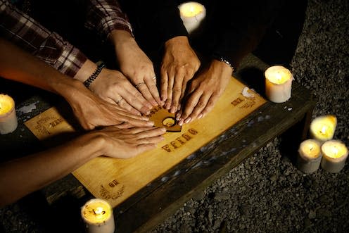 <span class="caption">The Ouija board was first developed in 1890.</span> <span class="attribution"><a class="link " href="https://www.shutterstock.com/image-photo/communicating-ghosts-through-spiritual-board-under-693915274" rel="nofollow noopener" target="_blank" data-ylk="slk:Couperfield/ Shutterstock;elm:context_link;itc:0;sec:content-canvas">Couperfield/ Shutterstock</a></span>