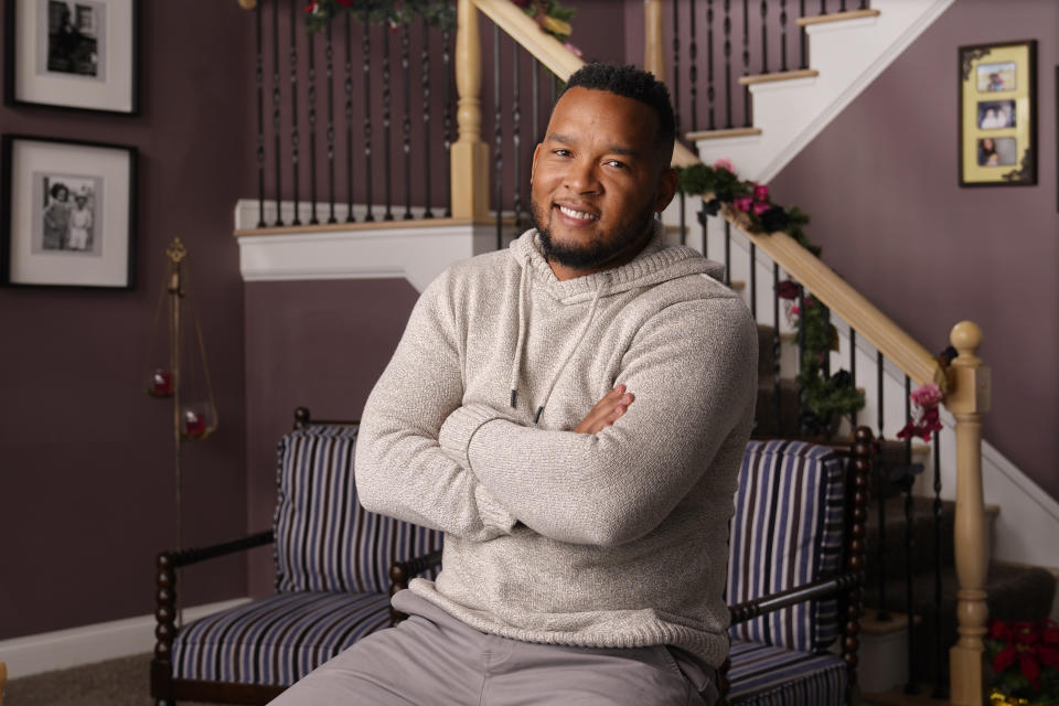 Bobby Mitchell poses in his home in Canal Winchester, Ohio, Dec. 19, 2020. He praises Trump for "taking care of Americans first in every trade deal," though "I don't think there's any Republican that I know that agrees with everything" the president has done. (AP Photo/Mark Humphrey)