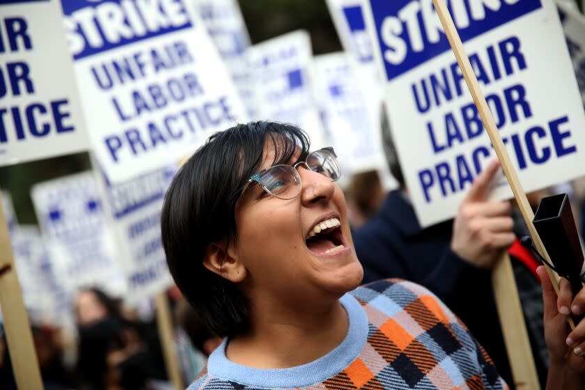 LOS ANGELES, CA - NOVEMBER 28: Tanya Gupta, a postdoctoral doing research, along with University of California academic workers strike walking the picket line on the Campus of the University of California, Los Angeles on Monday, Nov. 28, 2022 in Los Angeles, CA. As the nation's largest ever strike of higher-education academic workers enters its third week Monday, with the crunch time of final exams just days away, fears are rising over long-lasting and unintended consequences to the University of California's core missions of teaching and research. (Gary Coronado / Los Angeles Times)