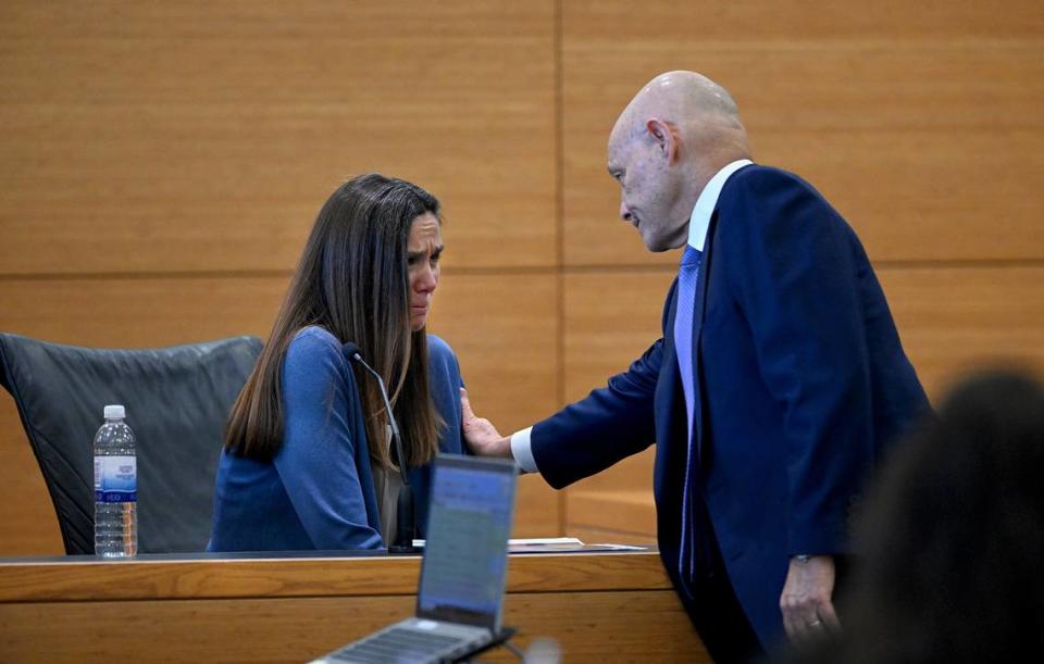 Ashley Benefield’s attorney Neil Taylor comforts her as she took the stand on the fourth day of her trial for the second-degree murder of her husband, Doug Benefield, in 2020 at the Manatee County Judicial Center, July 26, 2024.