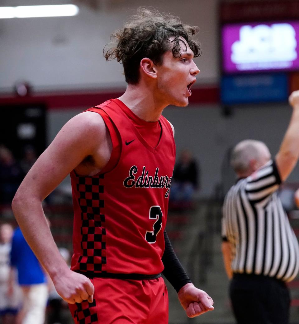 Edinburgh Lancers Caleb Dewey (3) yells in excitement on Tuesday, Dec. 28, 2021, at Edinburgh Community High School in Edinburgh. The Edinburgh Lancers defeated the North White Vikings, 57-47. 