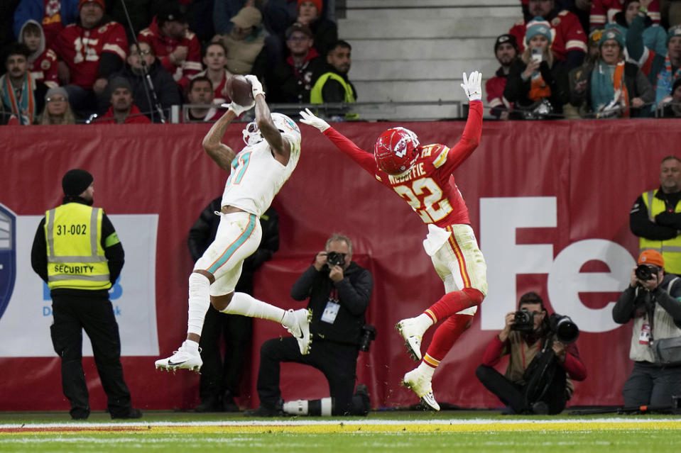 Miami Dolphins wide receiver Cedrick Wilson Jr (11) catches a touchdown pass against Kansas City Chiefs cornerback Trent McDuffie (22) during an NFL football game at Deutsche Bank Park Stadium in Frankfurt, Germany, Sunday, Nov. 5, 2023. The Dolphins defeated the Chiefs 21-14. (AP Photo/Doug Benc)