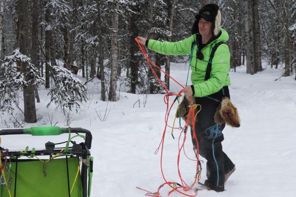 Ryan Redington, the 2023 Iditarod Trail Sled Dog champion, prepares to hook dogs up to his sled Monday, Feb. 26, 2024, in Knik, Alaska. Redington is one of three former champions in this year's race, which starts Saturday in Anchorage, Alaska. (AP Photo/Mark Thiessen)