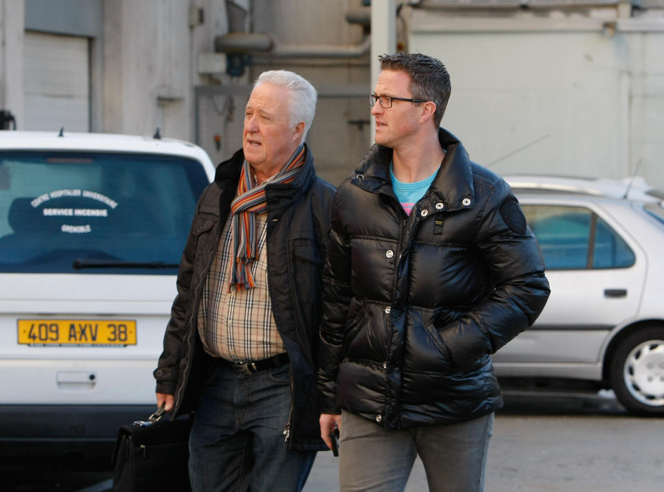 Michael Schumacher's father Rolf, left, and brother Ralf arrive at Grenoble Hospital, French Alps, Sunday Jan. 5, 2014, where former seven-time Formula One champion Michael Schumacher is being treated after sustaining a head injury during a ski accident. Schumacher has been in a medically induced coma since Sunday, Dec. 29, 2013, when he struck his head on a rock while on a family vacation. (AP Photo/Claude Paris)