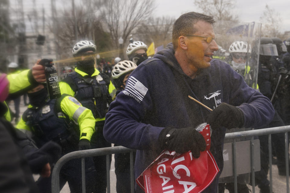 A rioter is sprayed with a chemical irritant at the U.S. Capitol on Jan. 6, 2021, in Washington. (AP Photo/John Minchillo)