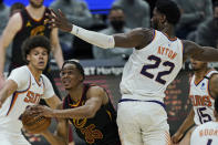 Cleveland Cavaliers' Isaac Okoro (35) drives to the basket against Phoenix Suns' Deandre Ayton (22) in the second half of an NBA basketball game, Tuesday, May 4, 2021, in Cleveland. (AP Photo/Tony Dejak)