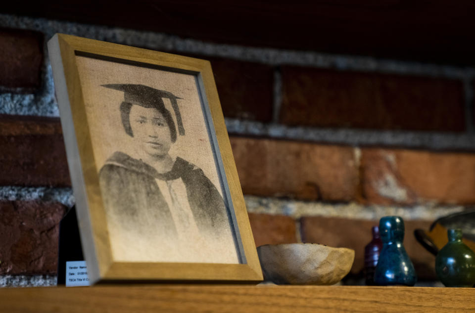 A photo of Maria Orosa, a Filipina food scientist who earned a bachelor's and master's degree at the University of Washington, is displayed on a shelf in the kitchen at Archipelago, Wednesday, May 24, 2023, in Seattle. Orosa is known for her WWII efforts feeding guerrillas fighting Japanese occupation in the Philippines, and for creating banana ketchup, calamansi juice powder, and soyalac. (AP Photo/Lindsey Wasson)