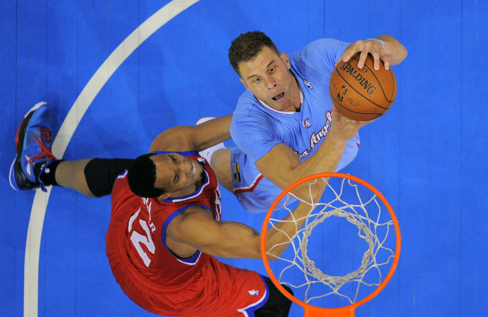 Los Angeles Clippers forward Blake Griffin, right, puts up a shot as Philadelphia 76ers forward Evan Turner defends during the first half of an NBA basketball game Sunday, Feb. 9, 2014, in Los Angeles. (AP Photo/Mark J. Terrill)