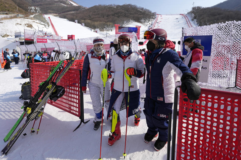 Mikaela Shiffrin, of the United States leaves the finish area after she skied out in the first run of the women's slalom at the 2022 Winter Olympics, Wednesday, Feb. 9, 2022, in the Yanqing district of Beijing. (AP Photo/Luca Bruno)