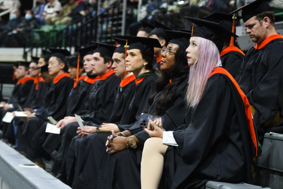 Advanced degree candidates listen as MSU Interim President Teresa Woodruff speaks on Friday, Dec. 16, 2022, during the 2022 Fall Commencement ceremony at the Breslin in East Lansing.