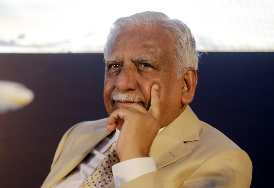 In this Wednesday, Nov. 29, 2017, file photo, Jet Airways Chairman Naresh Goyal sits during a press conference to announce the signing of enhanced cooperation agreement with Air France-KLM in Mumbai, India. The chairman of India's private Jet Airways has quit amid mounting financial woes forcing the airline to suspend operations on 14 international routes with more than 80 planes grounded. (AP Photo/Rajanish Kakade)