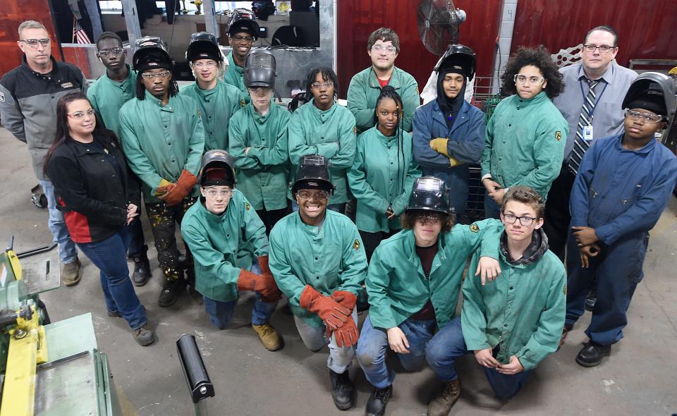 Erie High School freshmen, sophomores and welding instructors are shown in the welding lab, part of the school's career and technical education program.