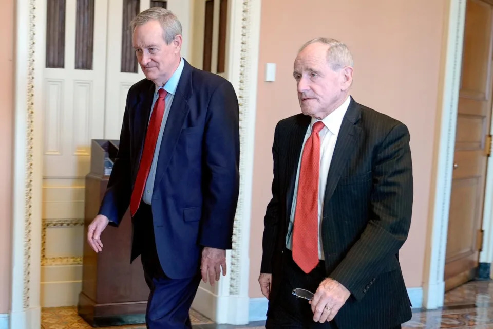 PHOTO: Sen. Mike Crapo, R-Idaho, left and Sen. Jim Risch, R-Idaho, right, walks through the U.S. Capitol, Feb. 7, 2024, in Washington. (Mariam Zuhaib/AP)