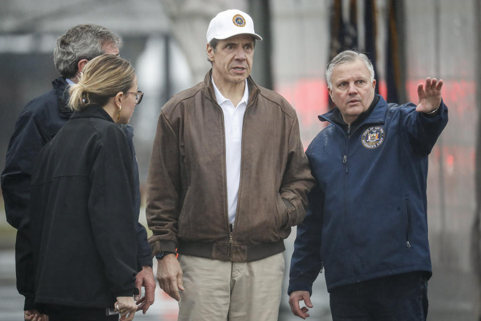 New York Governor Andrew Cuomo tours a COVID-19 infection testing facility at Glen Island Park, Friday, March 13, 2020, in New Rochelle, N.Y. State officials have set up a “containment area” in the New York City suburb, where schools and houses of worship are closed within a 1-mile radius of a point near a synagogue where an infected person with coronavirus had attended events. State officials stress it is not a lockdown. The vast majority of people recover from the new coronavirus. According to the World Health Organization, most people recover in about two to six weeks, depending on the severity of the illness. (AP Photo/John Minchillo)