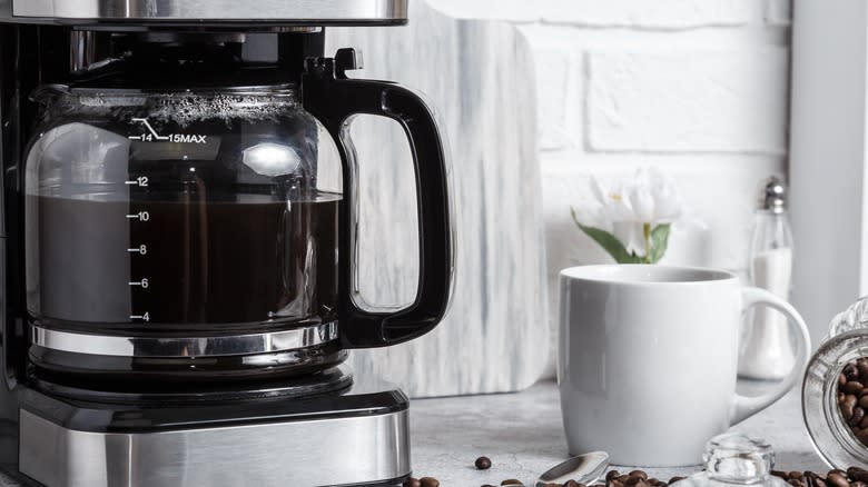 Smiling woman enjoying a mug of coffee