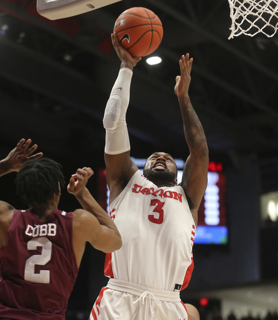 Dayton's Trey Landers (3) drives to the basket against Fordham's Jalen Cobb (2) during the first half of an NCAA college basketball game Saturday, Feb. 1, 2020, in Dayton, Ohio. (AP Photo/Tony Tribble)