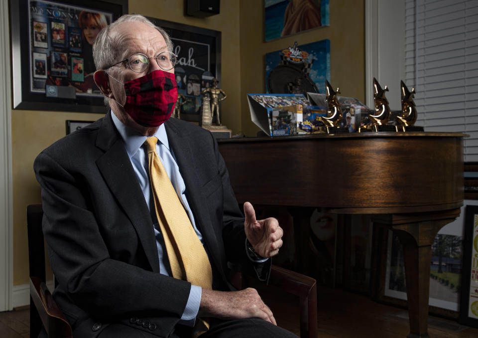 FILE - In this Nov. 20, 2020, file photo Sen. Lamar Alexander, R-Tenn., speaks from behind a face mask during an interview in Nashville, Tenn. (AP Photo/Wade Payne, File)