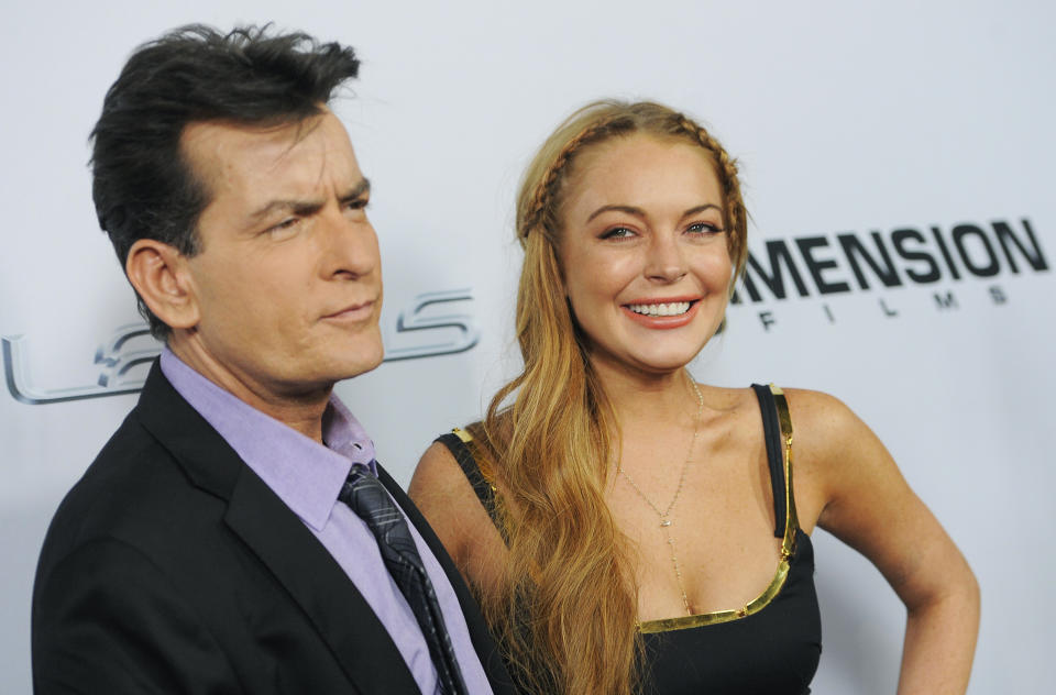 Charlie Sheen, left, and Lindsay Lohan, cast members in "Scary Movie V," pose together at the Los Angeles premiere of the film at the Cinerama Dome on Thursday, April 11, 2013 in Los Angeles. (Photo by Chris Pizzello/Invision/AP)