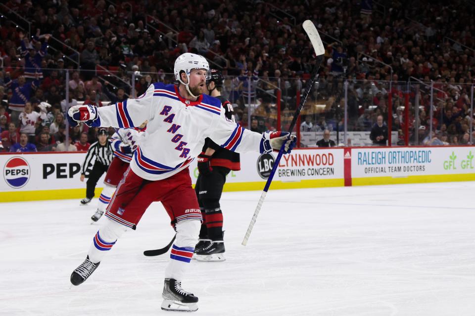 New York Rangers forward Alexis Lafrenière celebrates after scoring a goal against the Carolina Hurricanes.