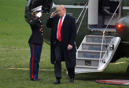 U.S. President Donald Trump salutes upon disembarking from Marine One on the South Lawn as he returns to the White House in Washington, U.S., from a weekend at his Mar-a-Lago estate in Florida, March 24, 2019. REUTERS/Mike Theiler