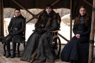 This image released by HBO shows from left to right Maisie Williams, Isaac Hempstead Wright and Sophie Turner in a scene from the final episode of "Game of Thrones," that aired Sunday, May 19, 2019. (HBO via AP)