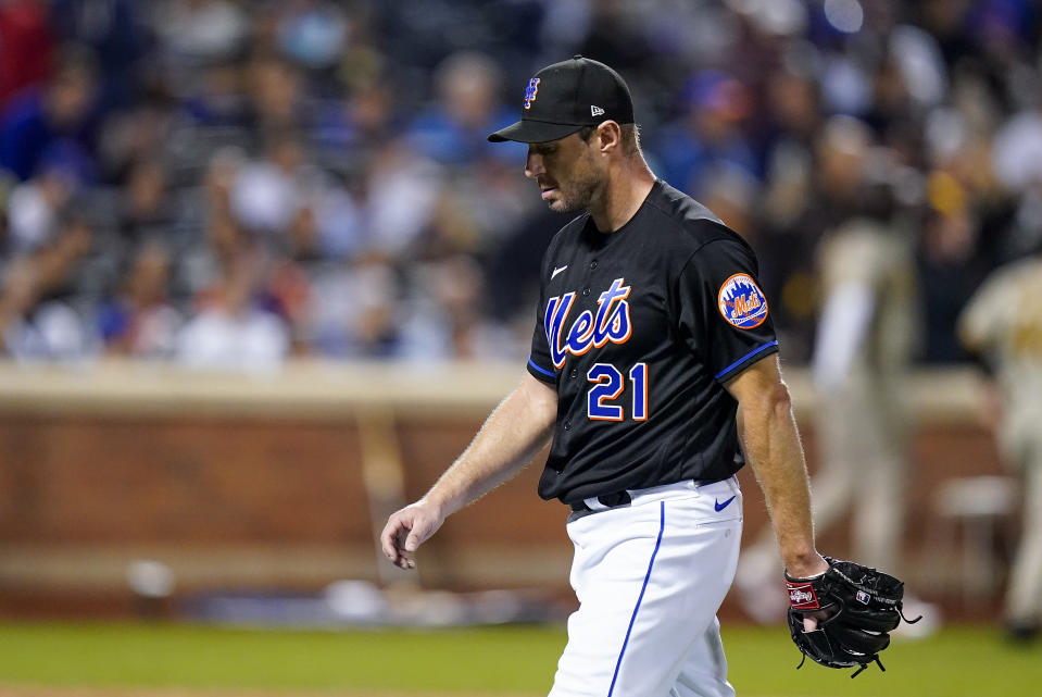 New York Mets starting pitcher Max Scherzer (21) walks off the field after being relieved during the fifth inning of Game 1 of a National League wild-card baseball playoff series against the San Diego Padres, Friday, Oct. 7, 2022, in New York. (AP Photo/Frank Franklin II)