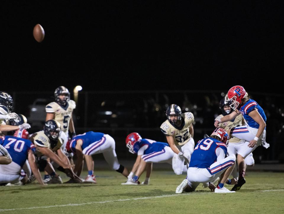 Riece Griffith (4) kicks the extra point to give the Patriots a 21-14 lead during the Gulf Breeze vs Pace football game at PaceHigh School on Friday, Sept. 30, 2022.