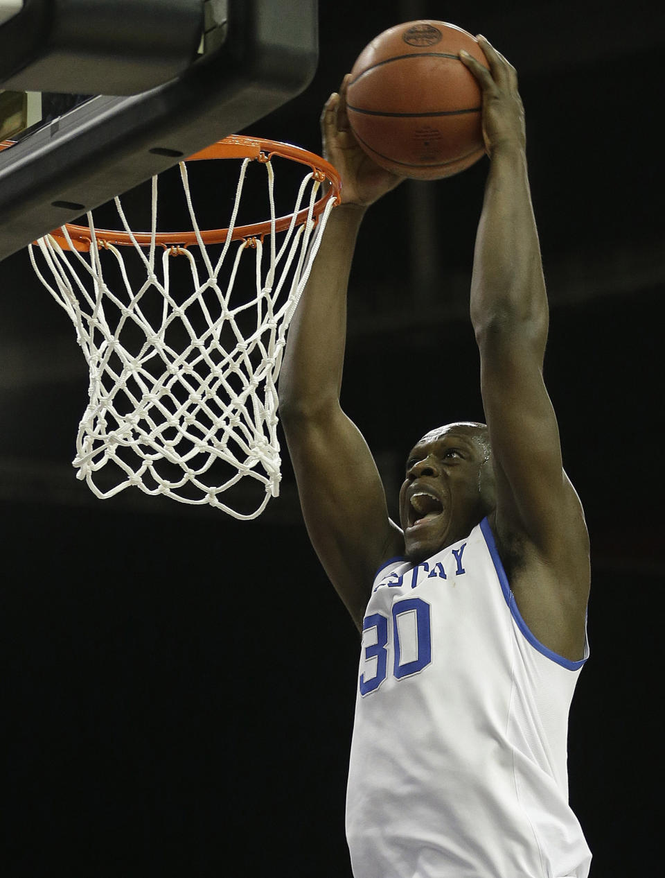 FILe - In this March 14, 2014 file photo, Kentucky forward Julius Randle (30) dunks the ball against LSU during the second half of an NCAA college basketball game in the quarterfinal round of the Southeastern Conference men's tournament, in Atlanta. Randle will leave after one season to enter the NBA draft, where he is expected to be among the top five selections. With five days left before the deadline for underclassmen to declare, the 6-foot-9 Dallas native announced, Tuesday, April 22, 2014, the decision many expected even before he arrived as part of Kentucky's best recruiting class ever. (AP Photo/Steve Helber, File)