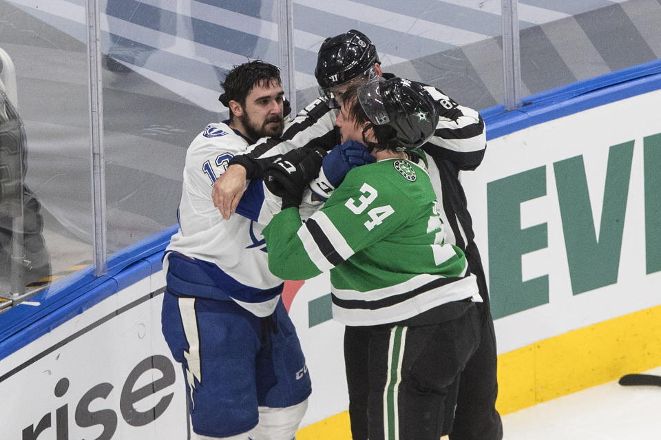 Dallas Stars right wing Denis Gurianov (34) and Tampa Bay Lightning center Cedric Paquette (13) scuffle during the first period of Game 3 of the NHL hockey Stanley Cup Final, Wednesday, Sept. 23, 2020, in Edmonton, Alberta. (Jason Franson/The Canadian Press via AP)
