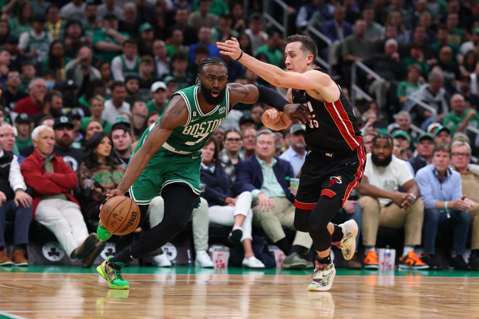 BOSTON, MASSACHUSETTS - MAY 25: Jaylen Brown #7 of the Boston Celtics controls the ball ahead of Duncan Robinson #55 of the Miami Heat during the fourth quarter in game five of the Eastern Conference Finals at TD Garden on May 25, 2023 in Boston, Massachusetts. NOTE TO USER: User expressly acknowledges and agrees that, by downloading and or using this photograph, User is consenting to the terms and conditions of the Getty Images License Agreement. (Photo by Maddie Meyer/Getty Images)