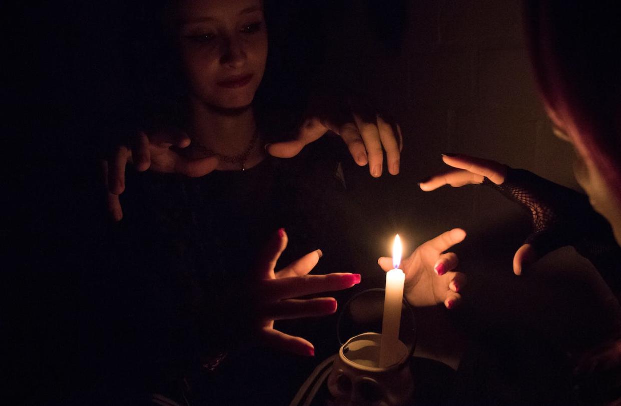 Fear about women's power was an essential part of ancient anxiety about witchcraft. <a href="https://www.gettyimages.com/detail/photo/women-practicing-witchcraft-by-burning-candle-in-royalty-free-image/720119557?phrase=witches&adppopup=true" rel="nofollow noopener" target="_blank" data-ylk="slk:Vinicius Rafael / EyeEm via Getty Images;elm:context_link;itc:0;sec:content-canvas" class="link ">Vinicius Rafael / EyeEm via Getty Images</a>