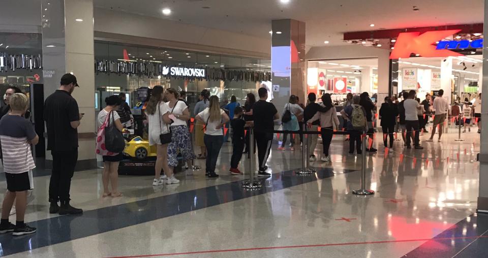 Shoppers pack a Kmart in Sydney despite COVID-19 restrictions.