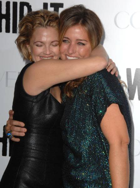 Drew Barrymore hugs Nancy Juvonen on the red carpet