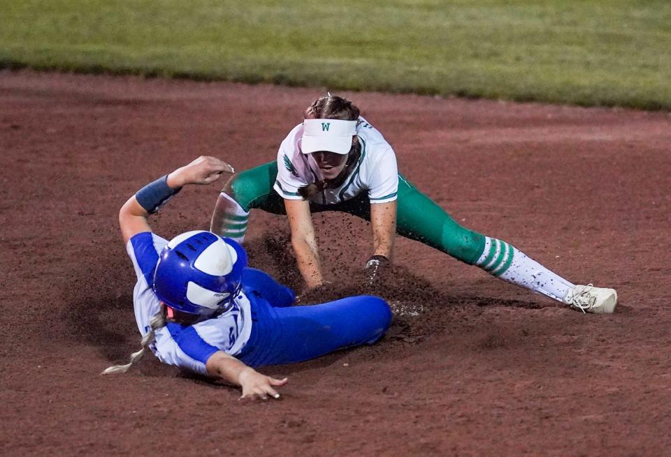 Southeast Warren's Josie Hartman (1) tags out Twin Cedars' Jetta Sterner (5) at second base during the Class 1A softball state championship at the Harlan Rogers Sports Complex Friday, July 22, 2022 in Fort Dodge. 
