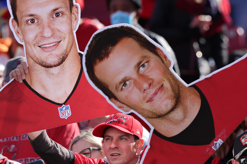 A fan with cutouts of Tampa Bay Buccaneers players Tom Brady and Rob Gronkowski. (Robert Gauthier/Los Angeles Times via Getty Images)