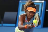 Tennis - Australian Open - Margaret Court Arena, Melbourne, Australia, January 22, 2018. Naomi Osaka of Japan hits a shot against Simona Halep of Romania. REUTERS/Issei Kato