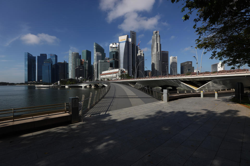 SINGAPORE - MARCH 24:  A general view of an empty attraction at a normally busy Jubilee Bridge and the Singapore skyline on March 24, 2020 in Singapore. Singapore will not allow short term visitors to enter or transit through the country from March 24 to contain the spread of the imported COVID-19  infection.  (Photo by Suhaimi Abdullah/Getty Images)