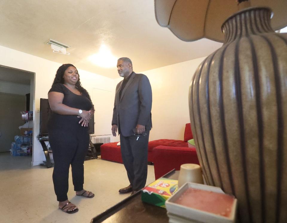 The Palmetto Park duplexes in Daytona Beach's Midtown neighborhood might be torn down at some point in the future as the Daytona Beach Housing Authority tries to upgrade its properties. Palmetto Park resident Emoni Bostick is pictured inside her unit talking with Charles Woodyard, CEO of the Daytona Beach Housing Authority.