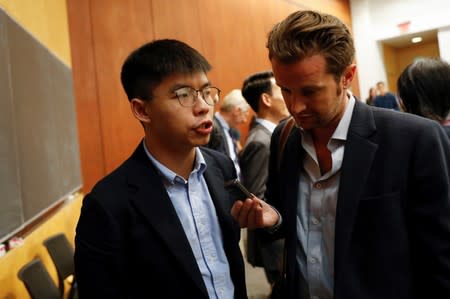 Hong Kong's pro-democracy activist Joshua Wong speaks to a reporter after a panel discussion on Anti-Extradition Law Movement in Hong Kong at Columbia University Law School in New York City