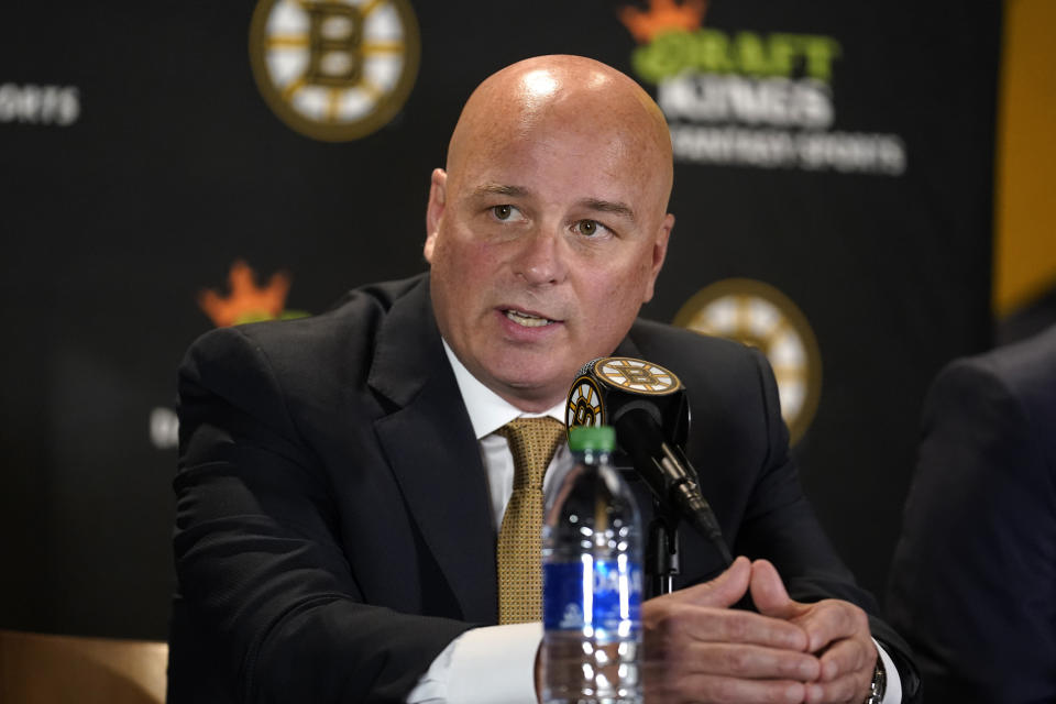 Boston Bruins newly hired head coach Jim Montgomery takes questions from members of the media during a news conference Monday, July 11, 2022, in Boston. The Bruins hired Montgomery as their new coach, giving the hockey lifer another chance at an NHL head-coaching job less than three years since he lost his first one. (AP Photo/Steven Senne)