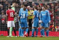 Football - Manchester United v Sunderland - Barclays Premier League - Old Trafford - 28/2/15 Referee Roger East mistakenly sends off Sunderland's Wes Brown as John O'Shea appeals Reuters / Phil Noble Livepic EDITORIAL USE ONLY. No use with unauthorized audio, video, data, fixture lists, club/league logos or "live" services. Online in-match use limited to 45 images, no video emulation. No use in betting, games or single club/league/player publications. Please contact your account representative for further details.