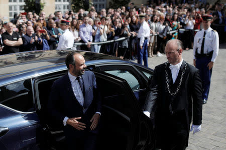 Newly-named French Prime Minister Edouard Philippe exists his car as he arrives to attend a handover ceremony with outgoing prime minister Bernard Cazeneuve (not pictured) at the Hotel Matignon in Paris, France, May 15, 2017. REUTERS/Benoit Tessier