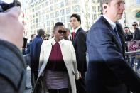 Actress Lupita Nyong'o arrives at Miu Miu's ready to wear fall/winter 2014-2015 fashion collection presented in Paris, Wednesday, March 5, 2014. (AP Photo/Zacharie Scheurer)